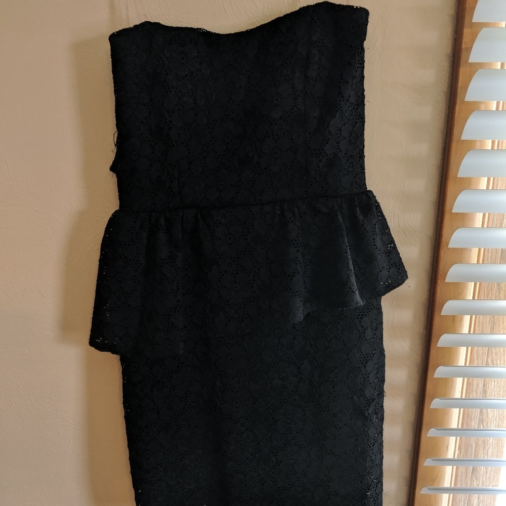 Strapless black lace peplum dress